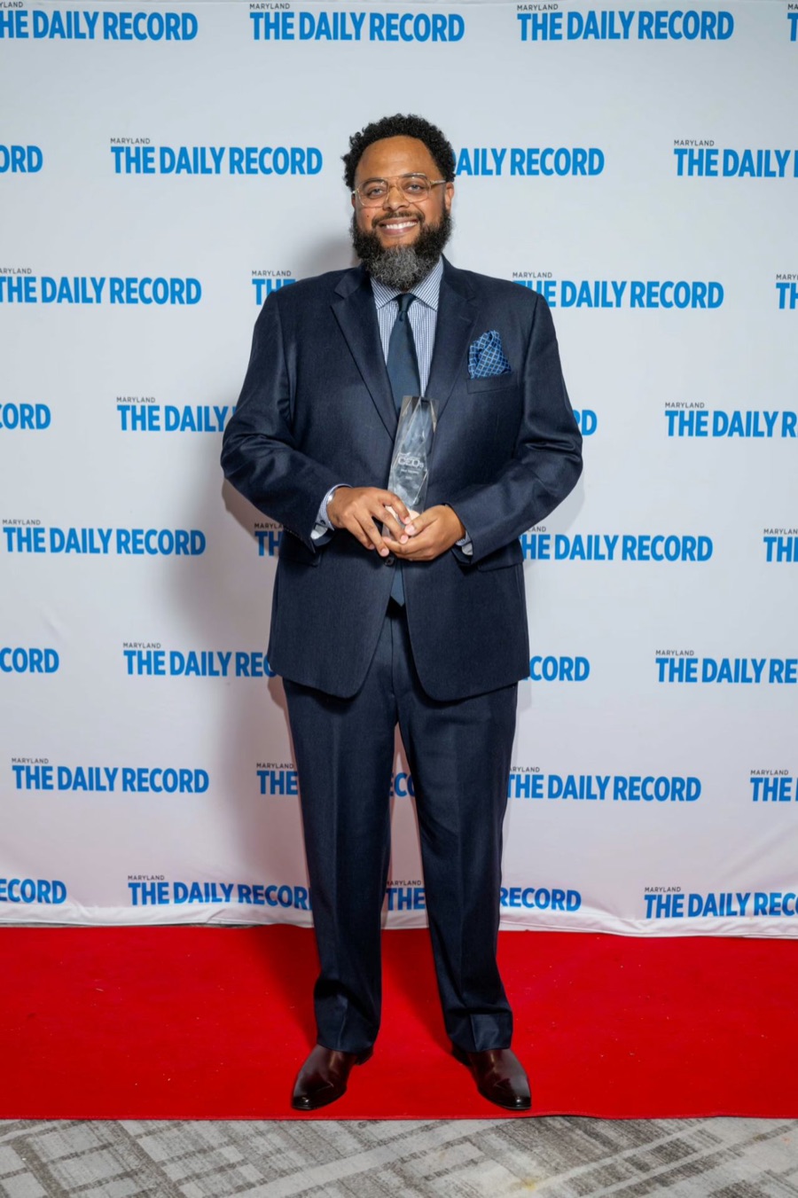 Nico Sanders receiving an award from The Daily Record